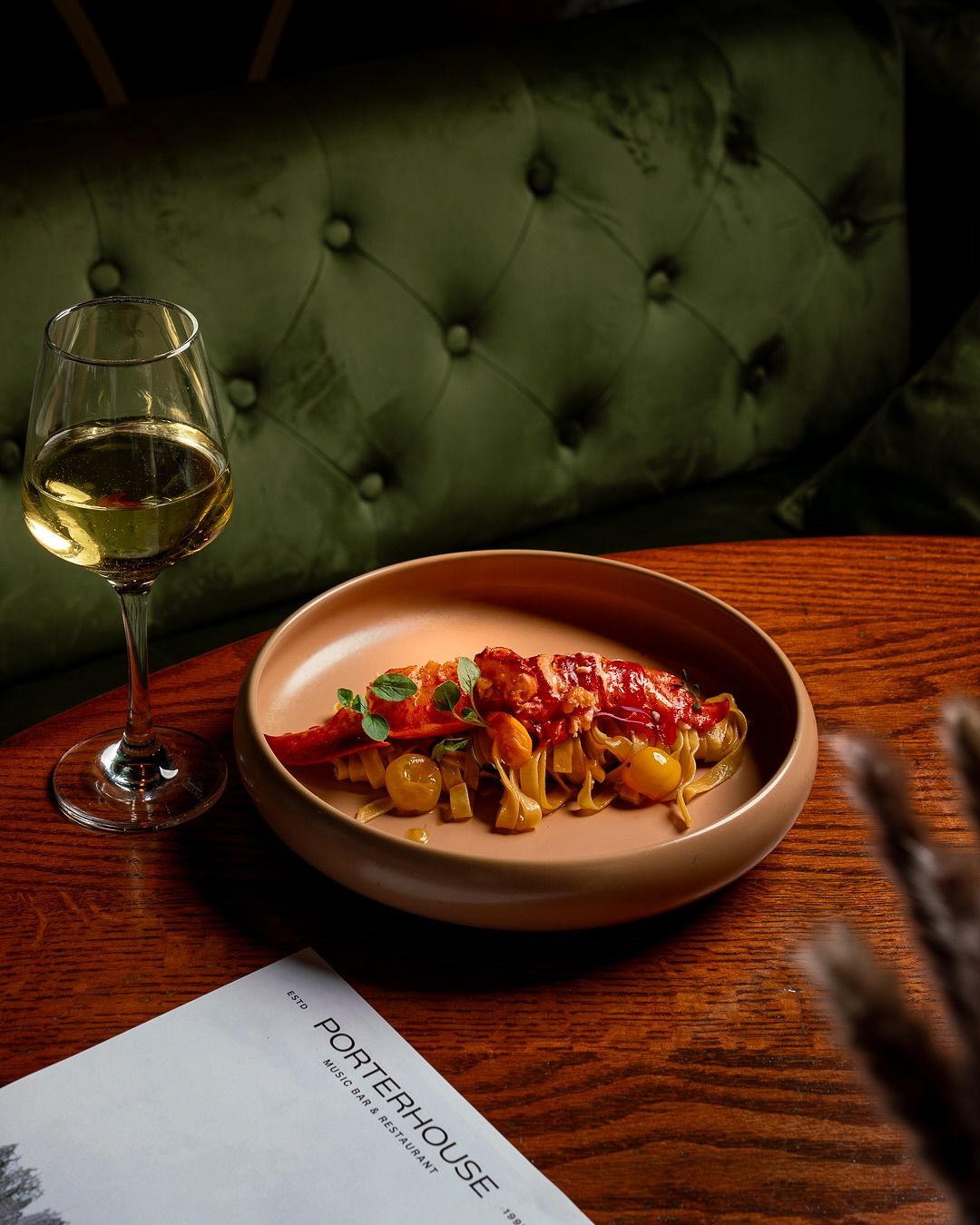 Pasta dish in a moody setting.